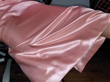 Long pink satin skirt with silky white half slip.